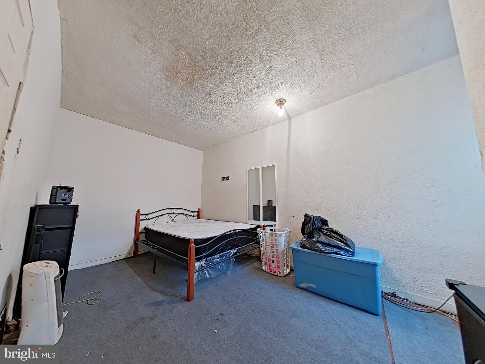 5152 Funston Street Philadelphia, PA 19139 - Photo 16 of 22 a room with furniture and a wooden floor