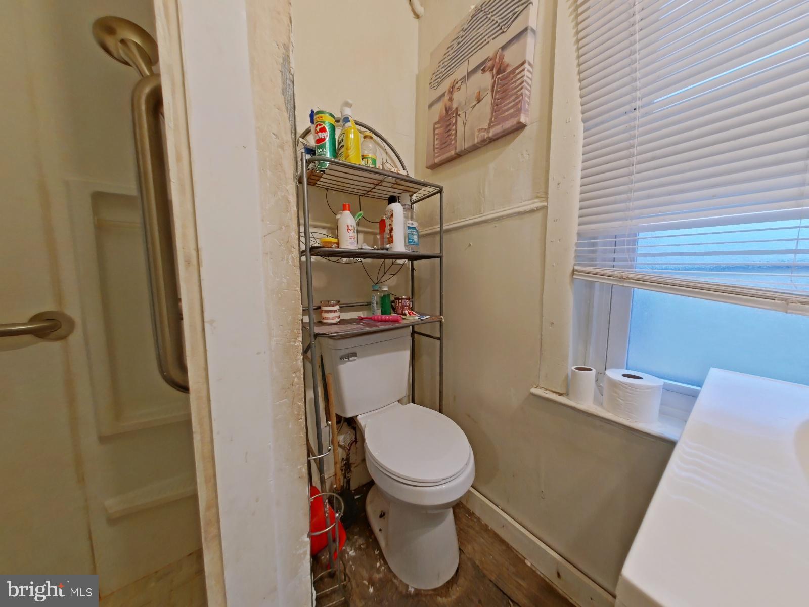 5152 Funston Street Philadelphia, PA 19139 - Photo 19 of 22 a bathroom with a toilet and a shower