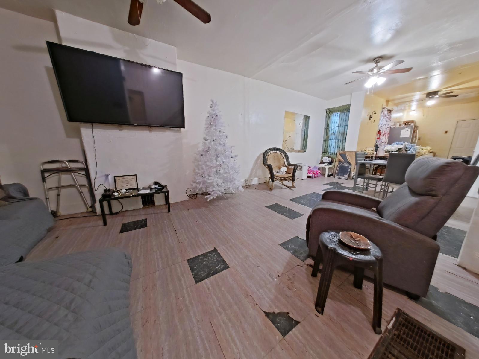 5152 Funston Street Philadelphia, PA 19139 - Photo 3 of 22 a living room with furniture and a flat screen tv