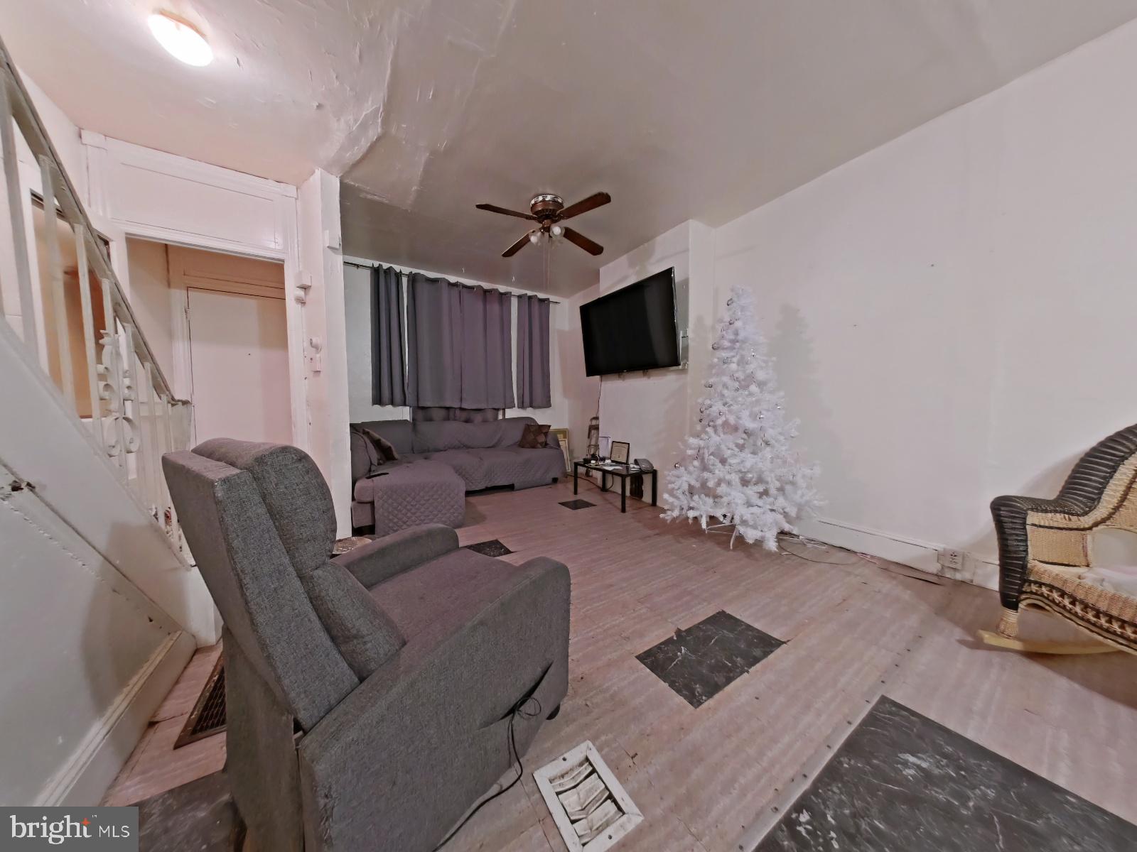 5152 Funston Street Philadelphia, PA 19139 - Photo 5 of 22 a living room with furniture and a flat screen tv