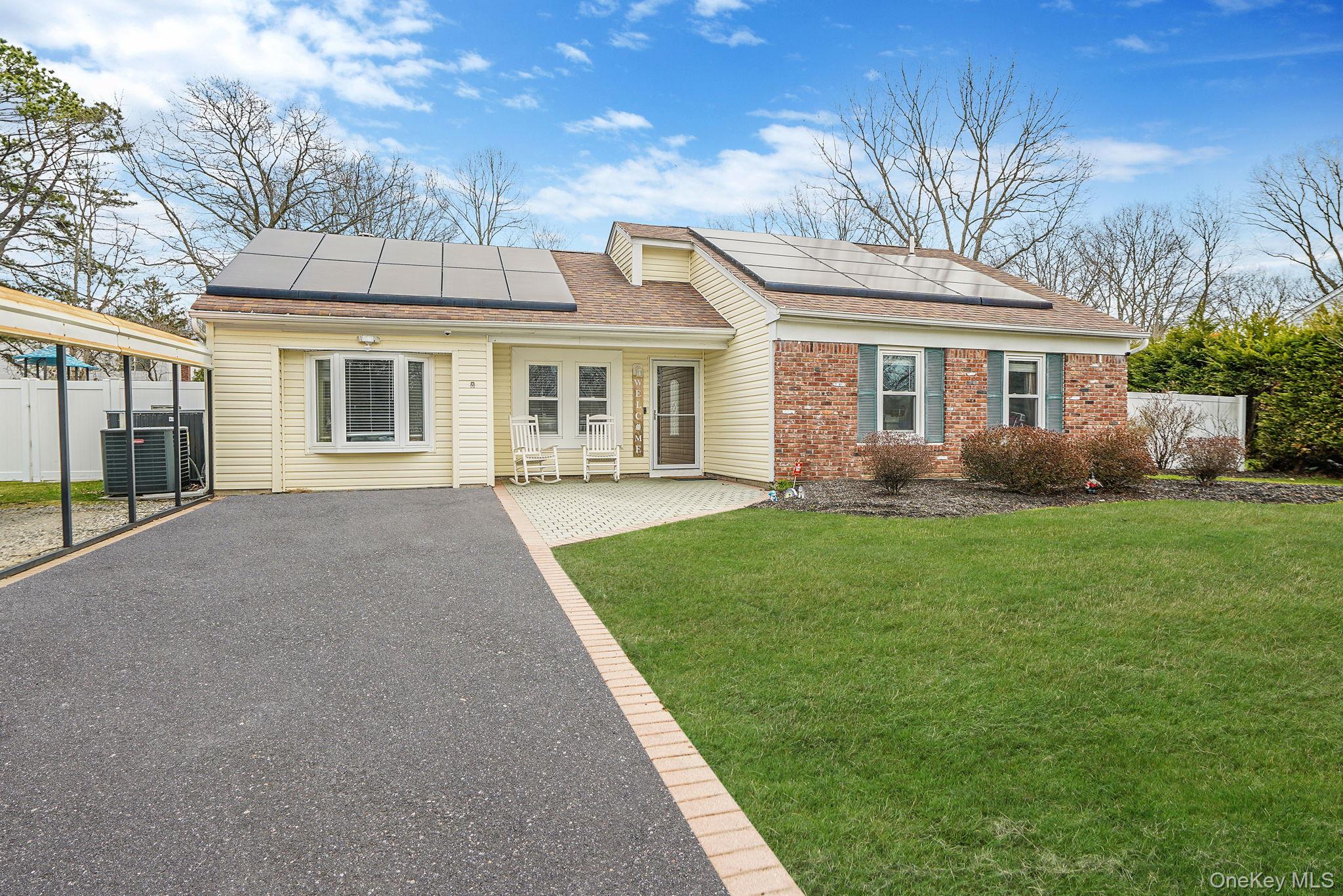 19 Goodwin Lane Coram, NY 11727 - Photo 1 of 36 a front view of house with yard and green space