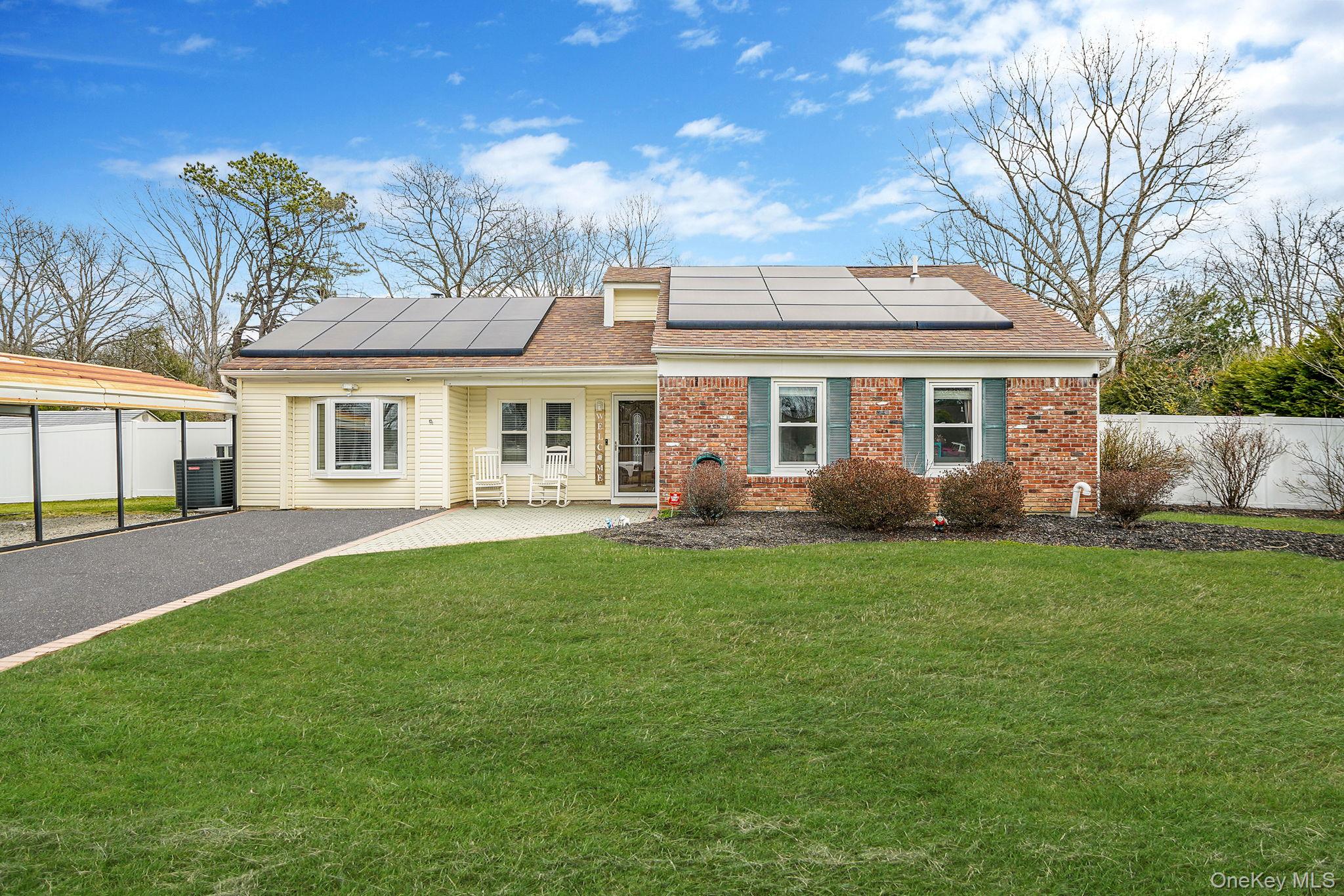 19 Goodwin Lane Coram, NY 11727 - Photo 21 of 36 a view of a house with a backyard