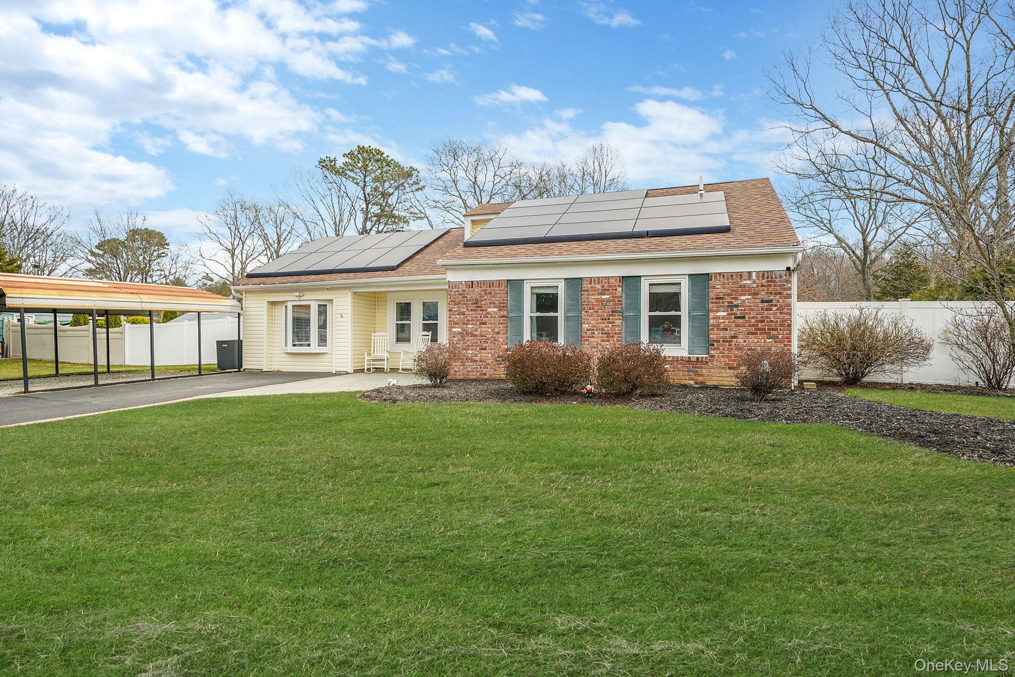 19 Goodwin Lane Coram, NY 11727 - Photo 22 of 36 a view of a house with a backyard