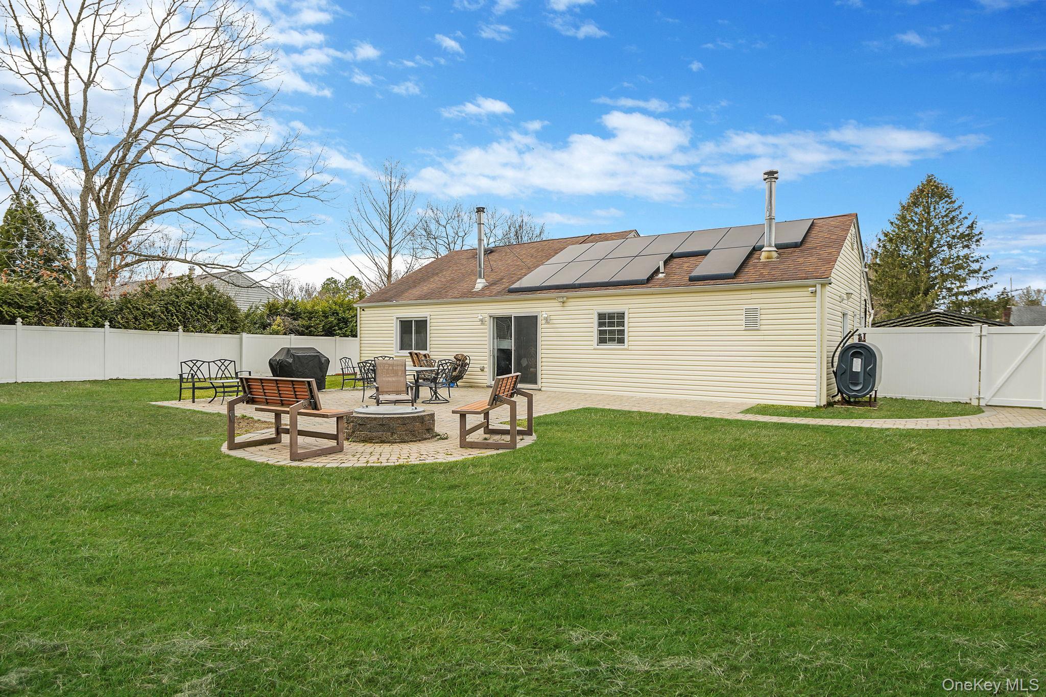 19 Goodwin Lane Coram, NY 11727 - Photo 26 of 36 a view of a house with backyard and sitting area