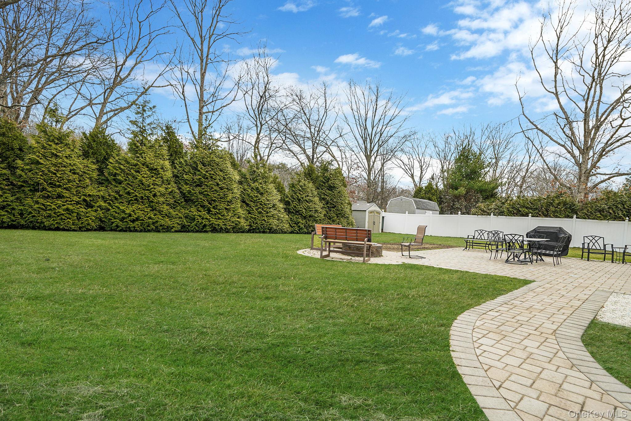19 Goodwin Lane Coram, NY 11727 - Photo 29 of 36 a view of a swimming pool with a patio