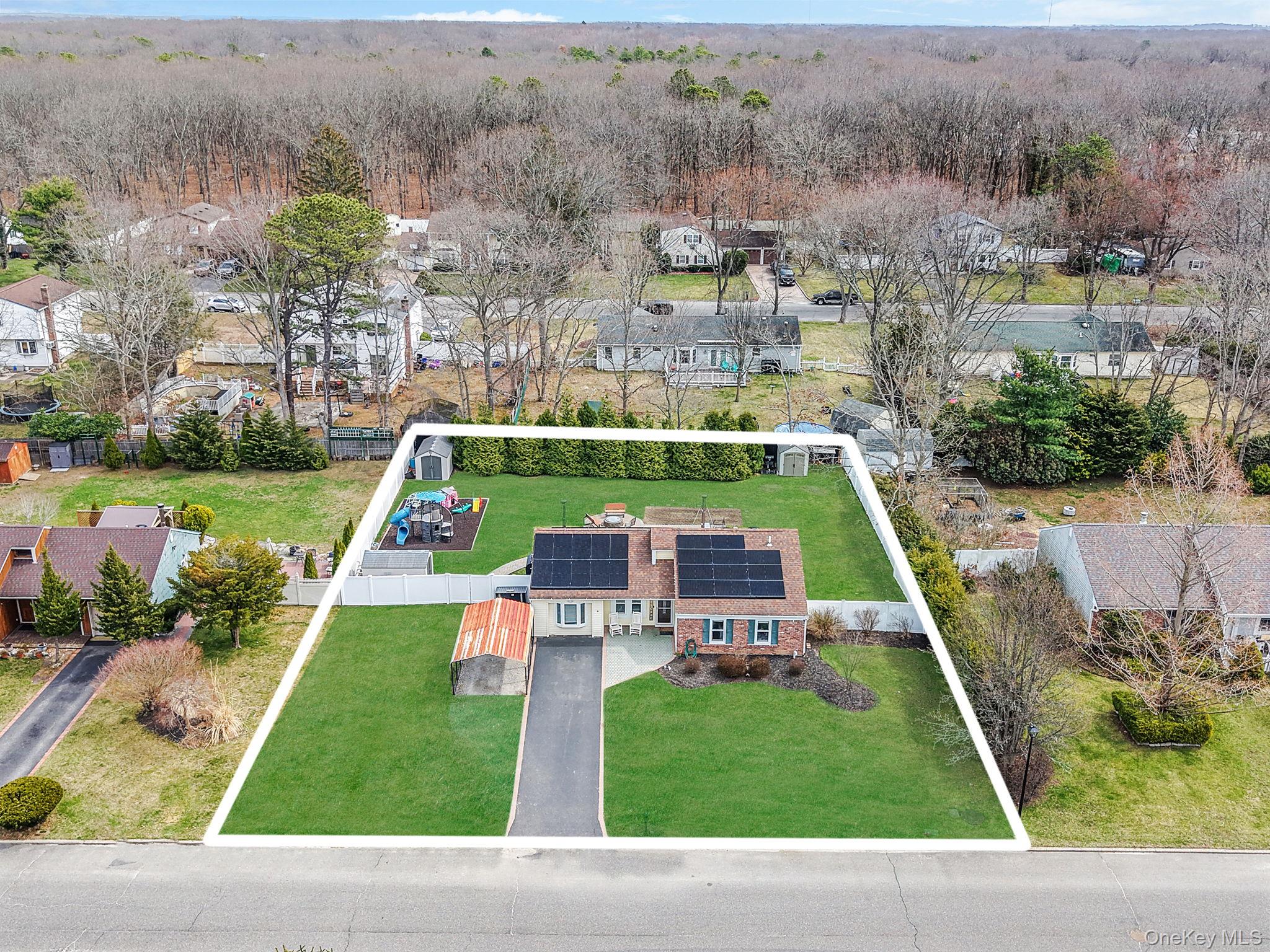 19 Goodwin Lane Coram, NY 11727 - Photo 30 of 36 an aerial view of a house with a yard