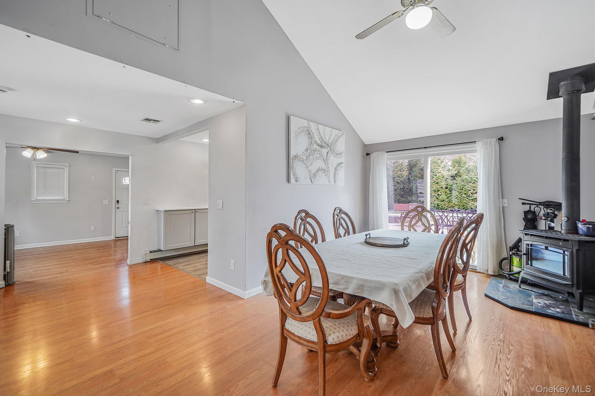19 Goodwin Lane Coram, NY 11727 - Photo 3 of 36 a dining room with furniture and wooden floor