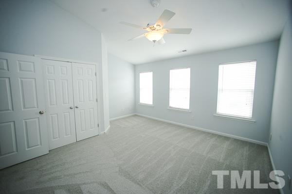 8222 City Loft Court Raleigh, NC 27613 - Photo 8 of 14 Vaulted ceiling with ceiling fan and a walk-in closet!