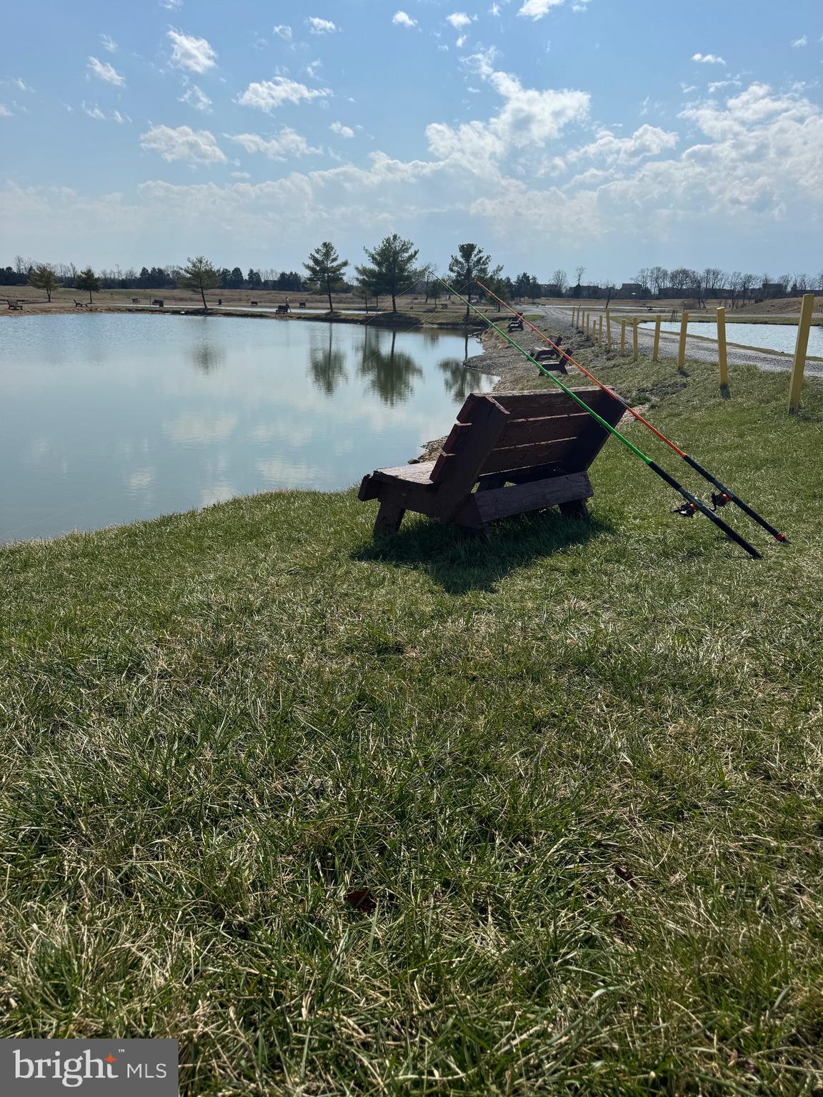 878 Hatchery Road Inwood, WV 25428 - Photo 18 of 131 a lake view with boat and palm trees