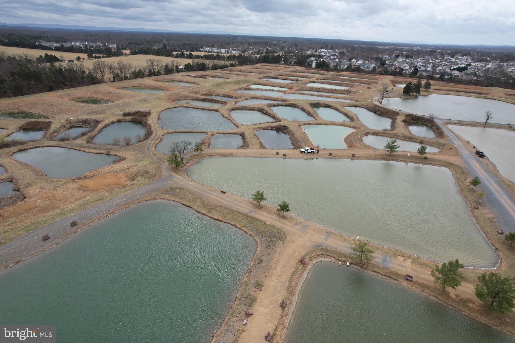 878 Hatchery Road Inwood, WV 25428 - Photo 19 of 131 an aerial view of a house with a yard