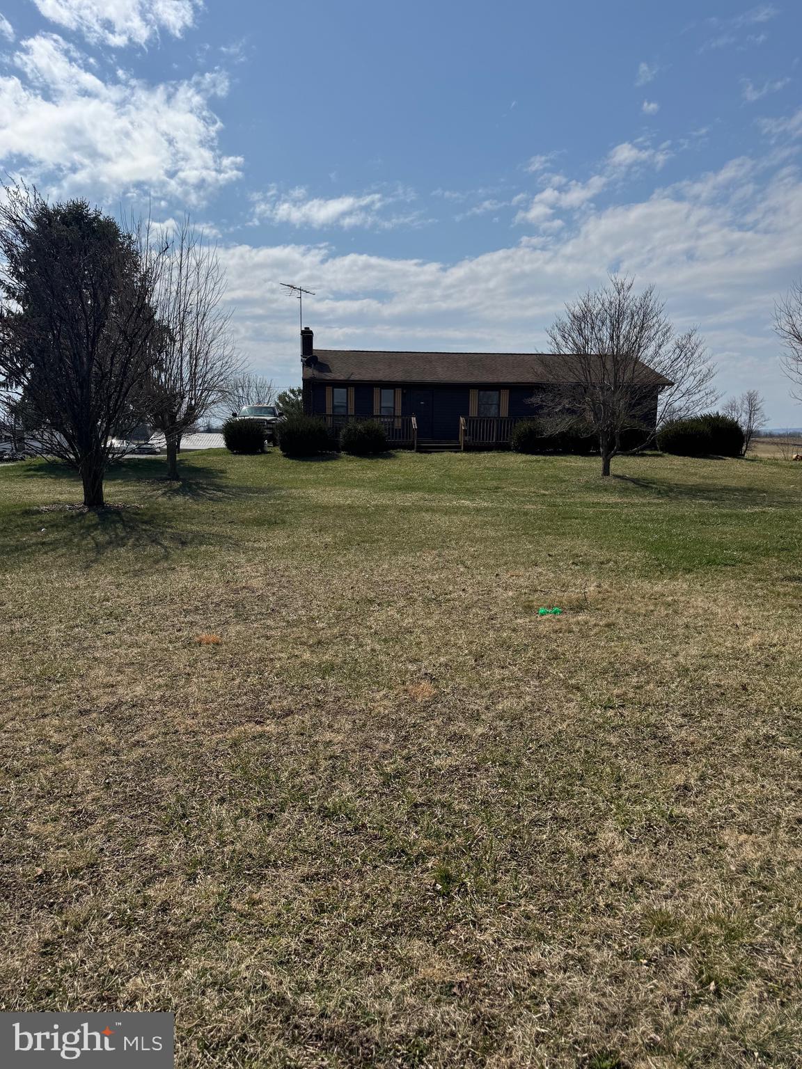 878 Hatchery Road Inwood, WV 25428 - Photo 2 of 131 a front view of a house with a yard