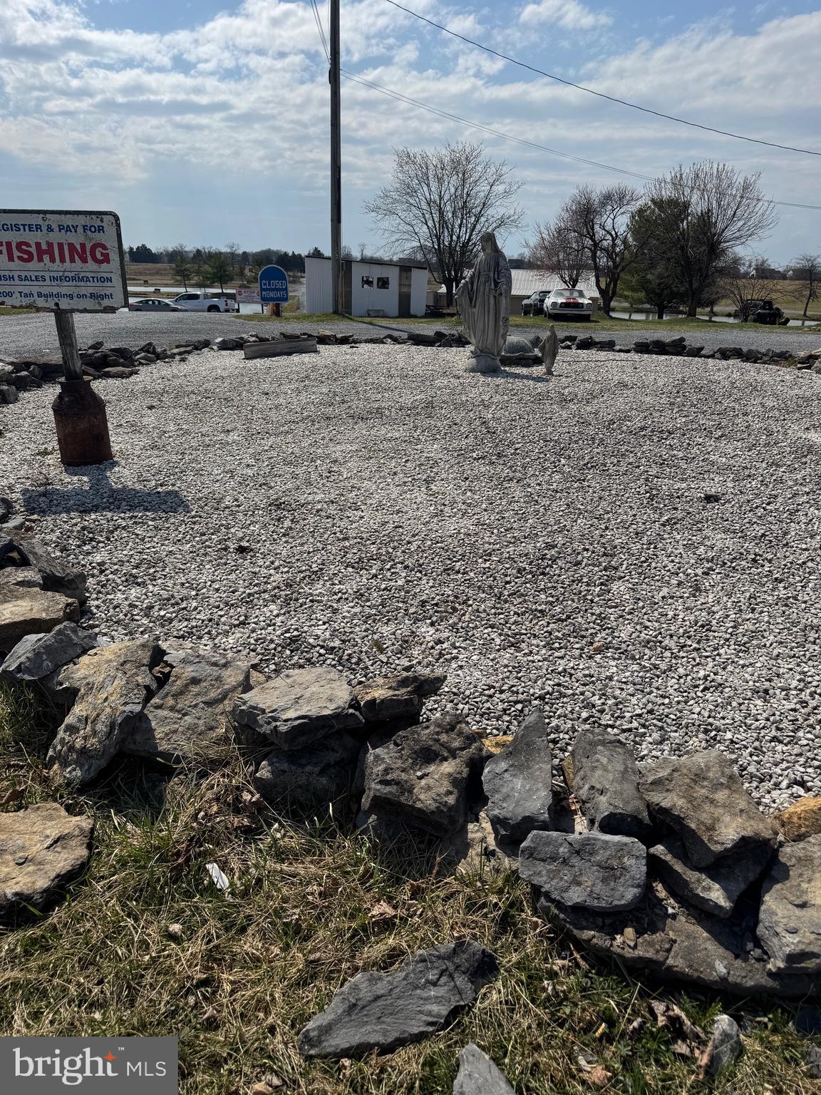 878 Hatchery Road Inwood, WV 25428 - Photo 34 of 131 a view of a parking space with lots of trees