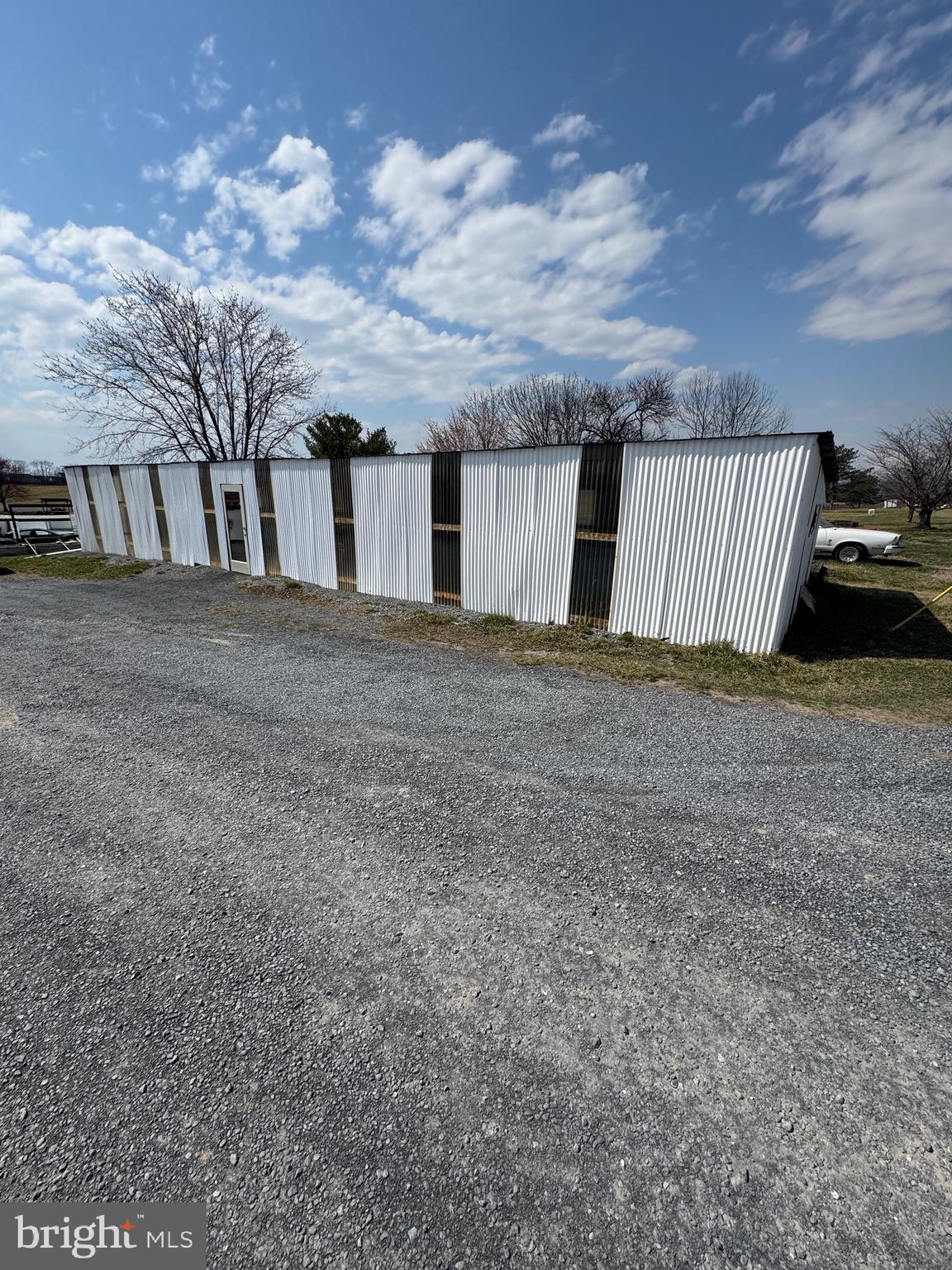 878 Hatchery Road Inwood, WV 25428 - Photo 38 of 131 a view of a house with a yard and garage
