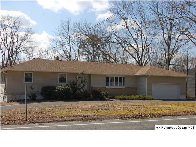 128 North Cooks Bridge Road Jackson, NJ 08527 - Photo 2 of 3 a front view of a house with a yard