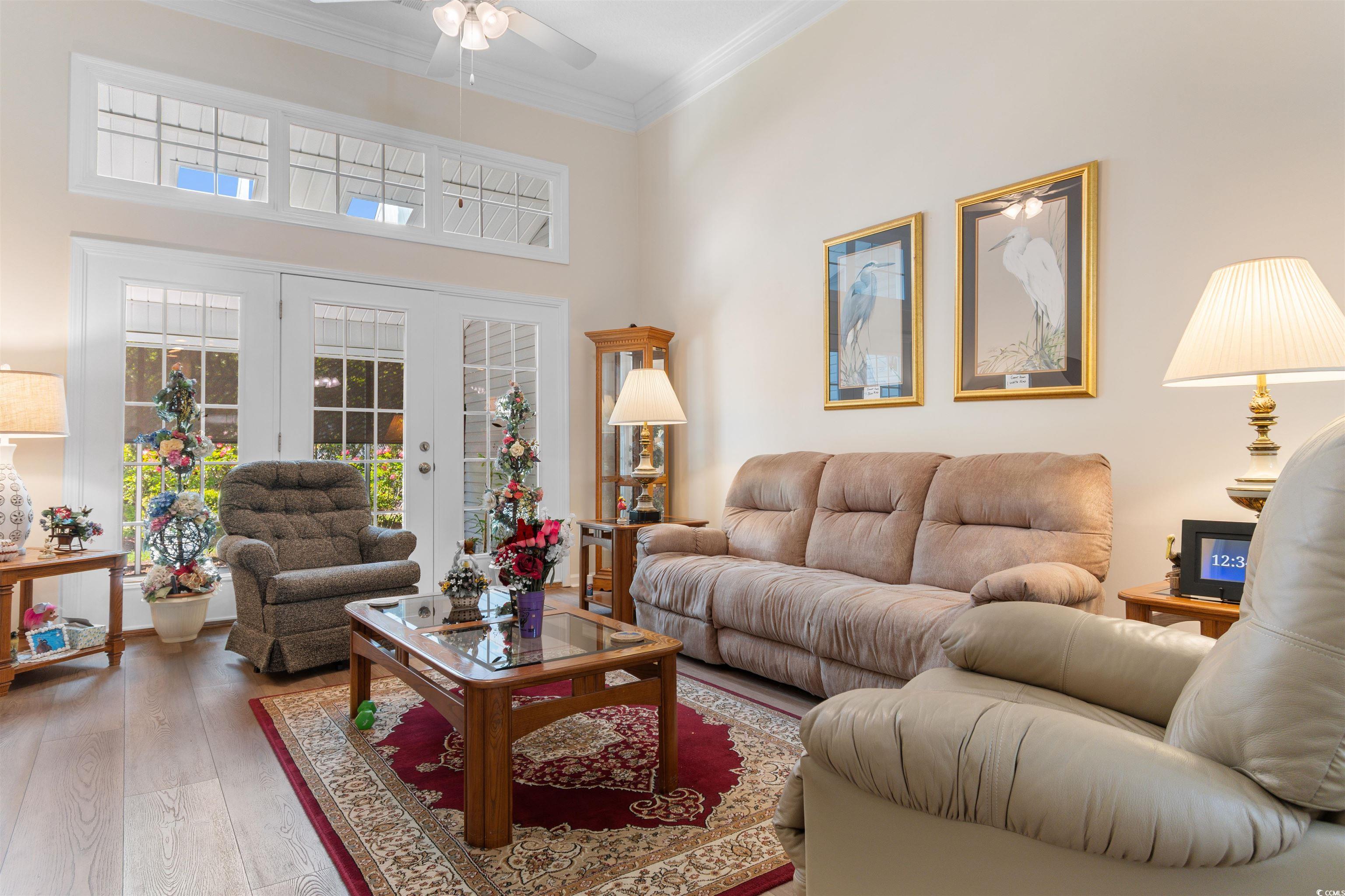 1000 Red Sky Lane, Unit 101 Murrells Inlet, SC 29576 - Photo 9 of 40 Living area with a high ceiling, light wood-type f