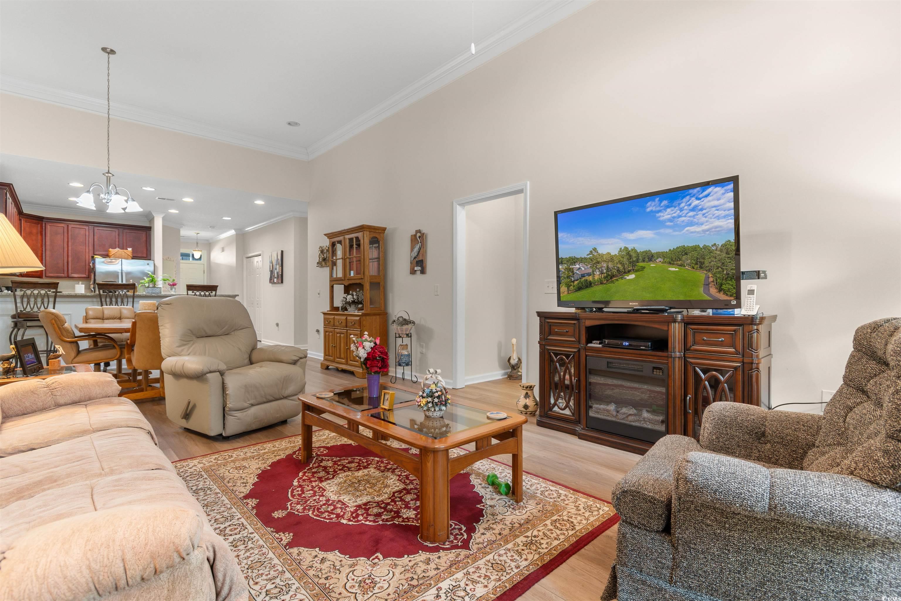1000 Red Sky Lane, Unit 101 Murrells Inlet, SC 29576 - Photo 10 of 40 Living area featuring ornamental molding, recessed