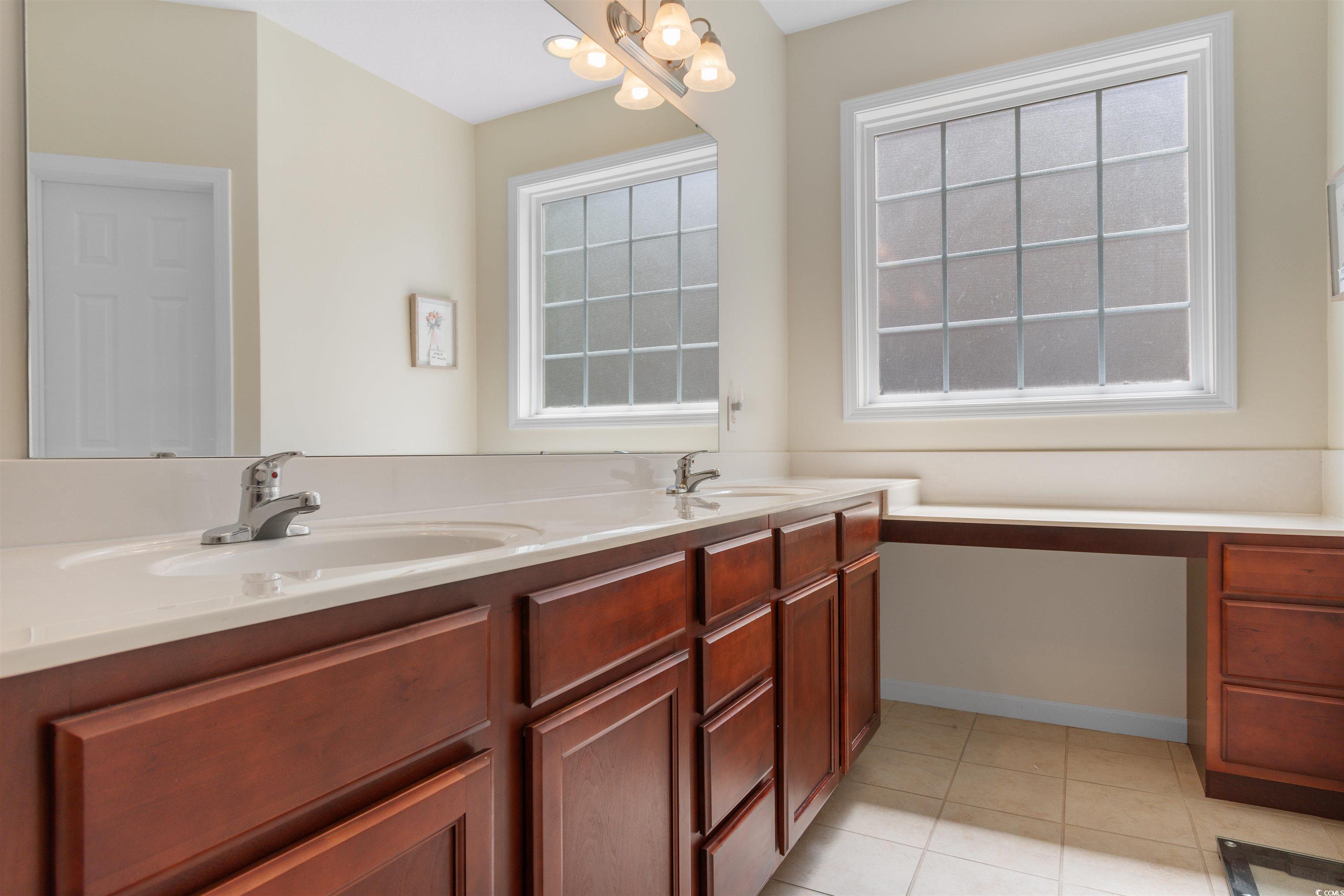 1000 Red Sky Lane, Unit 101 Murrells Inlet, SC 29576 - Photo 14 of 40 Full bathroom featuring double vanity, a sink, til