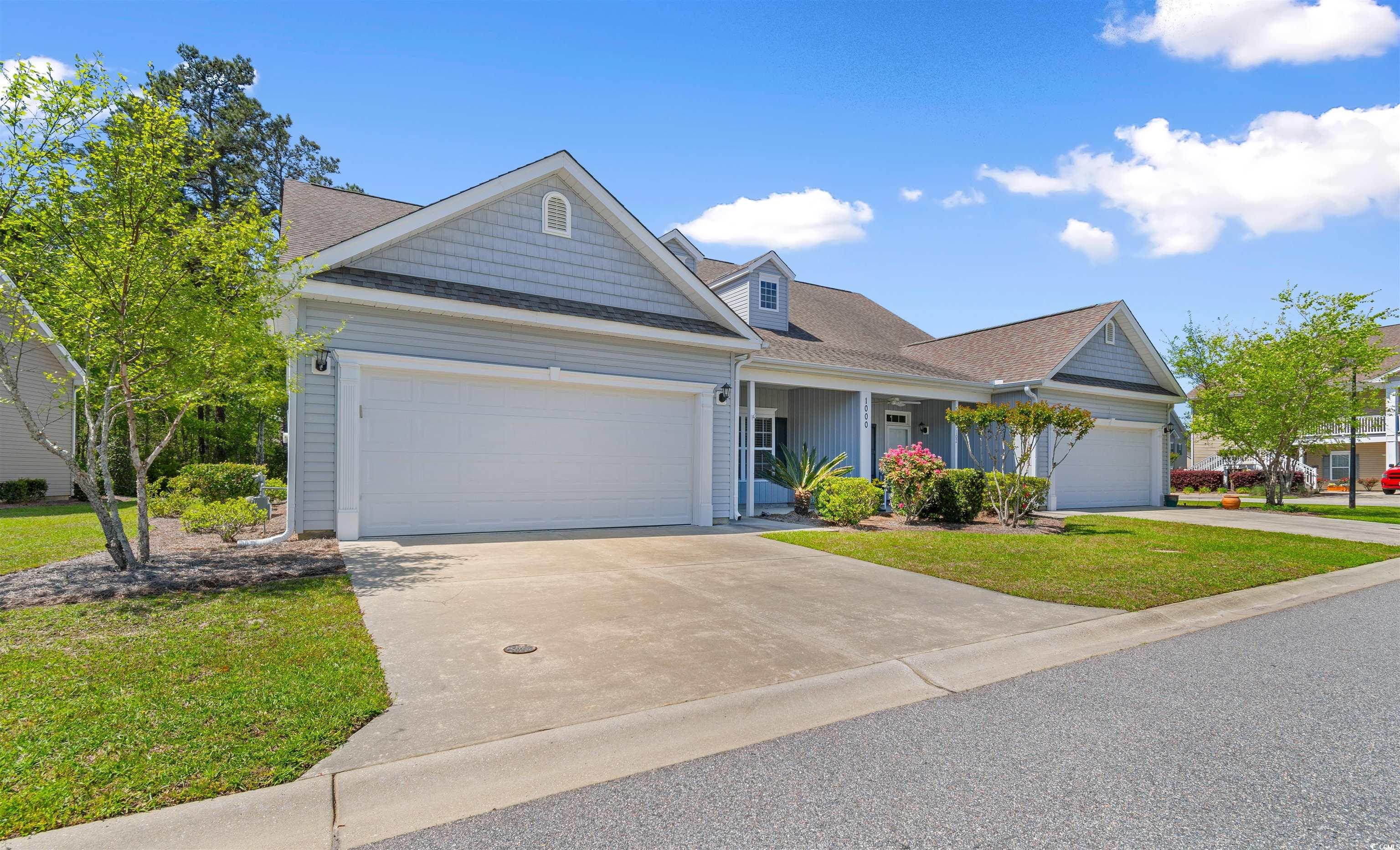 View of front of home featuring a garage, a front