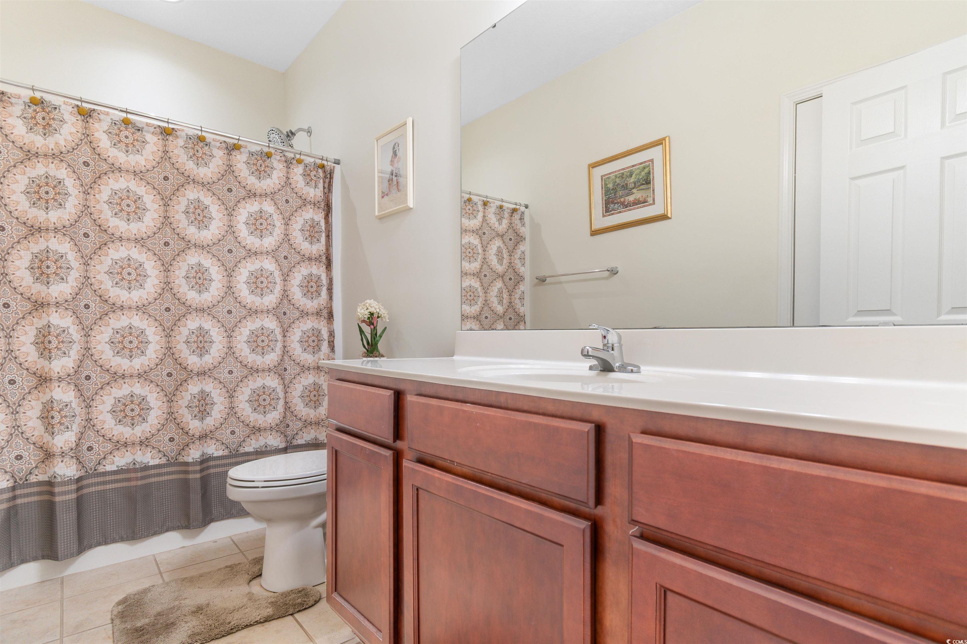 1000 Red Sky Lane, Unit 101 Murrells Inlet, SC 29576 - Photo 19 of 40 Bathroom featuring a shower with shower curtain, t