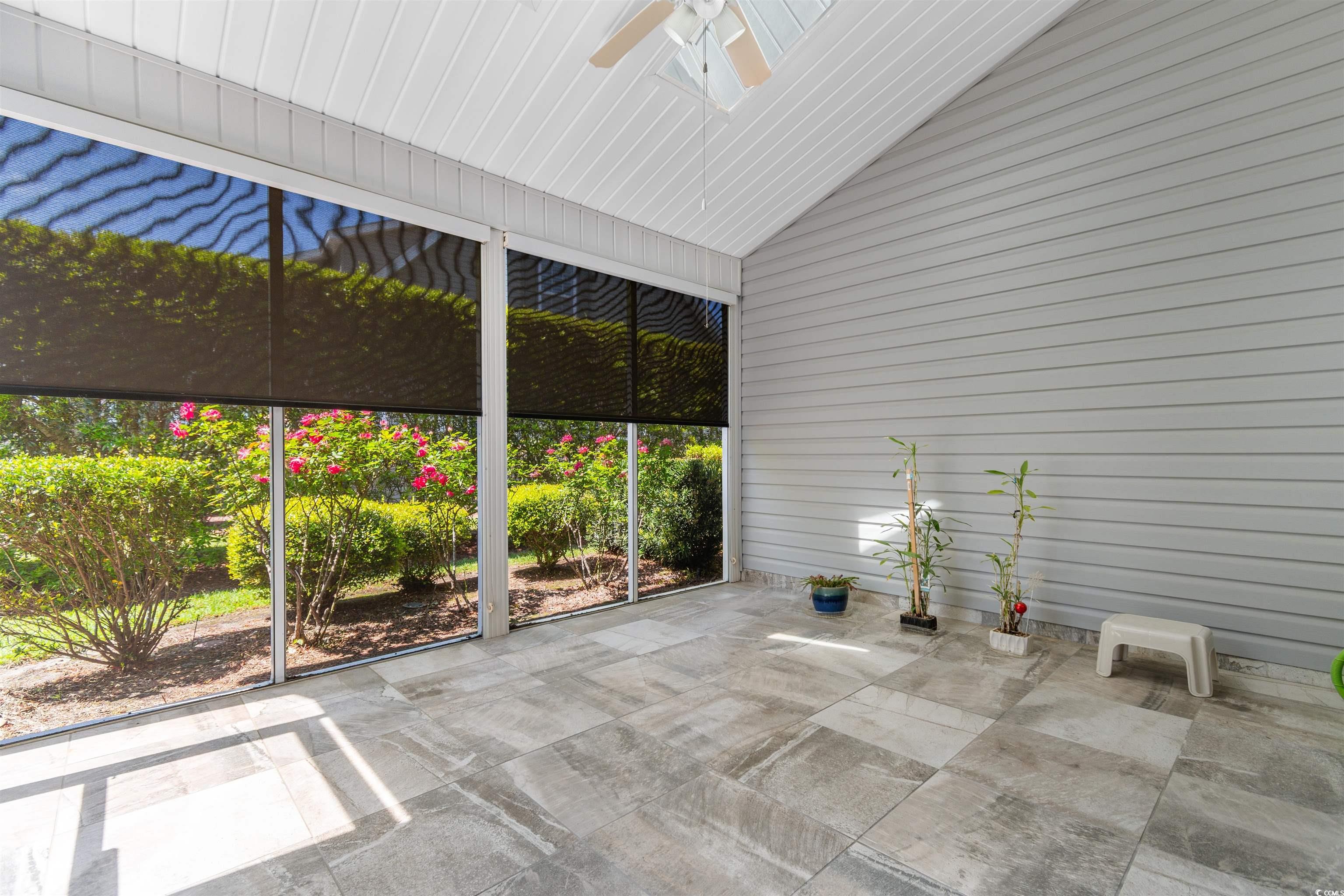1000 Red Sky Lane, Unit 101 Murrells Inlet, SC 29576 - Photo 23 of 40 Unfurnished sunroom with a ceiling fan