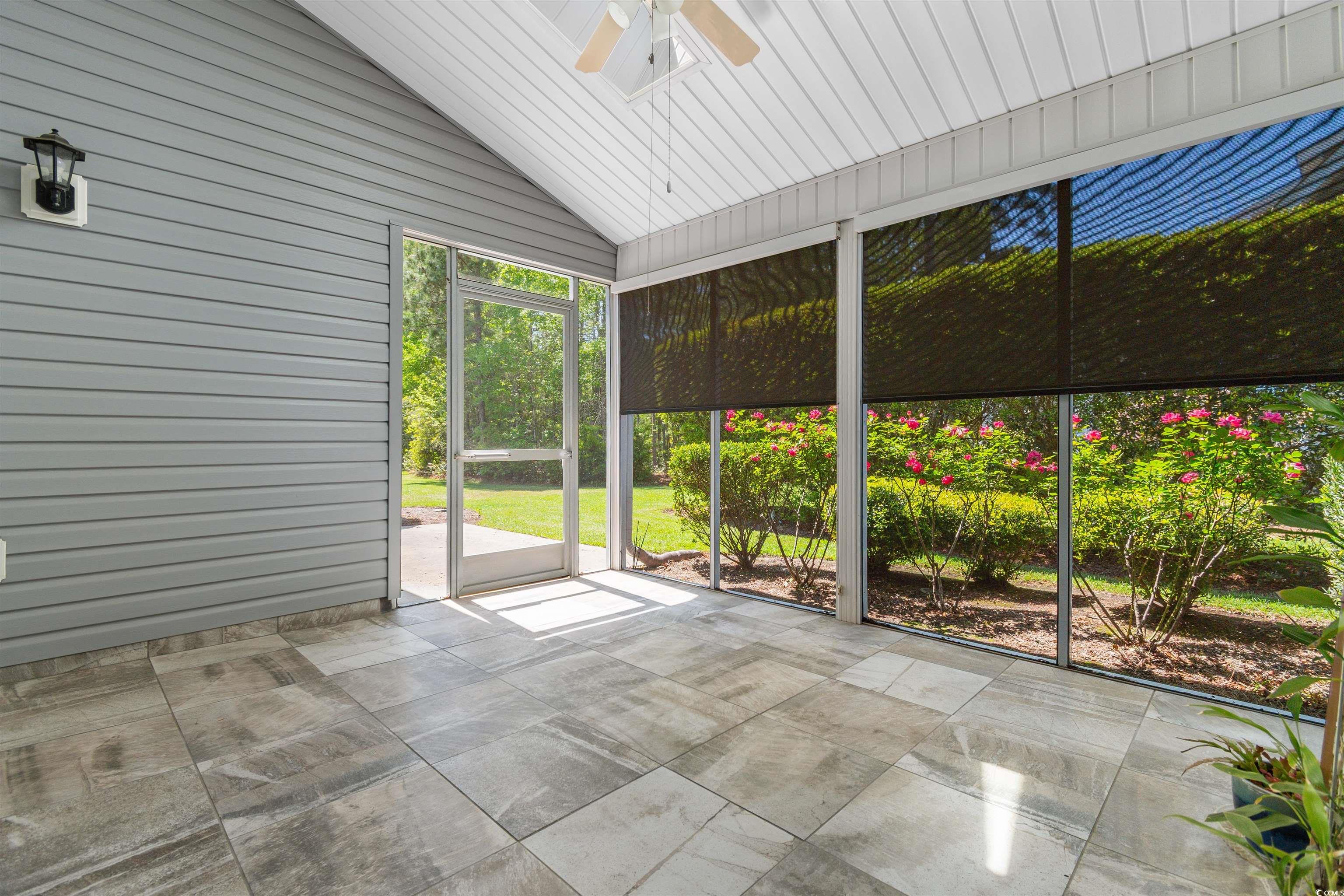1000 Red Sky Lane, Unit 101 Murrells Inlet, SC 29576 - Photo 24 of 40 Unfurnished sunroom with ceiling fan and a wealth