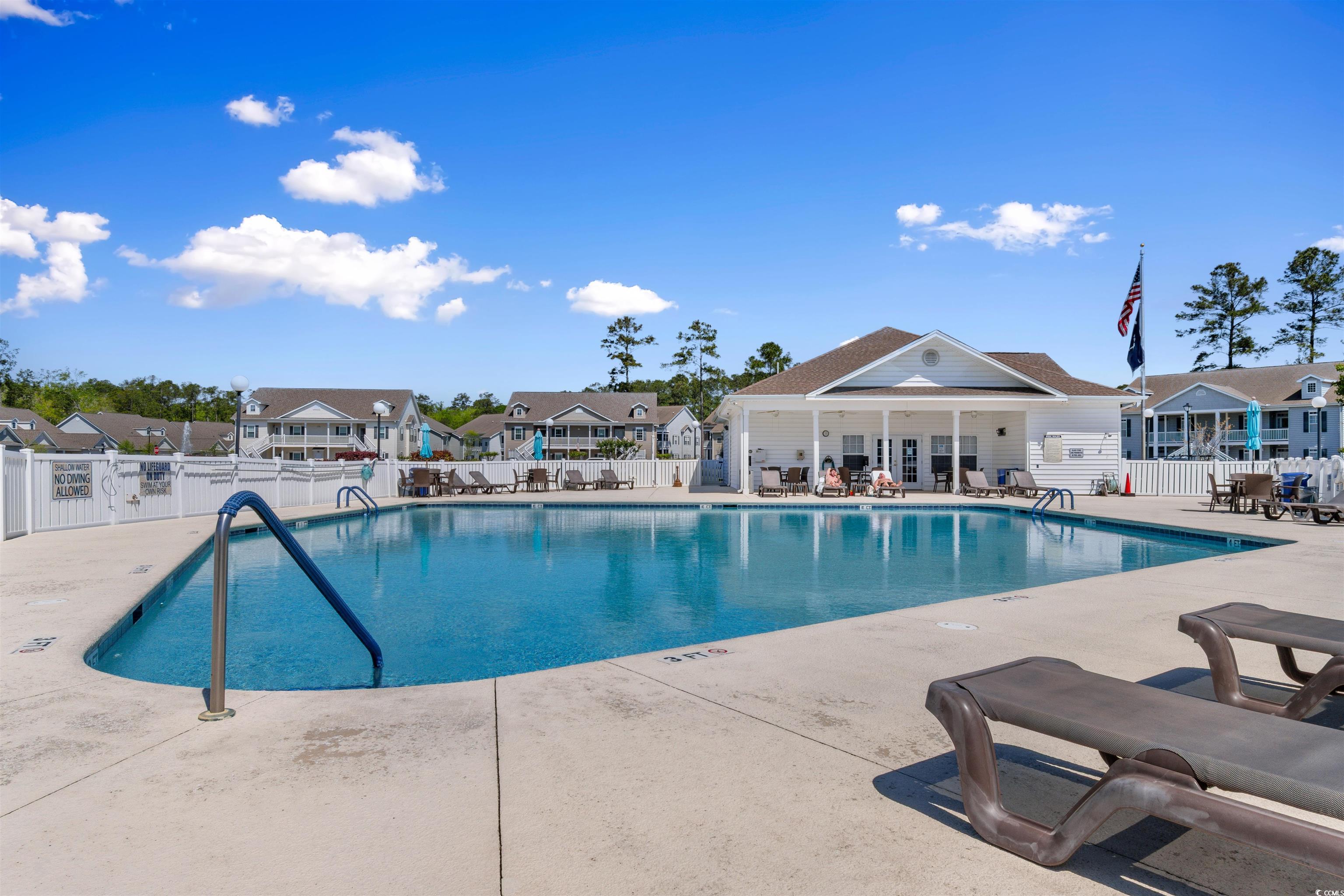 1000 Red Sky Lane, Unit 101 Murrells Inlet, SC 29576 - Photo 29 of 40 Community pool featuring a patio area, fence, and