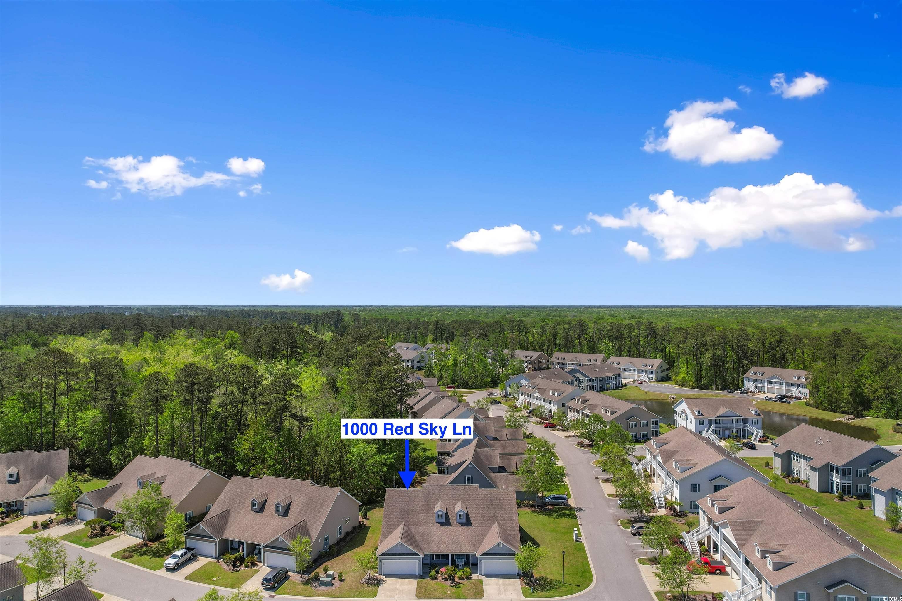 1000 Red Sky Lane, Unit 101 Murrells Inlet, SC 29576 - Photo 32 of 40 Aerial view with a view of trees and a residential