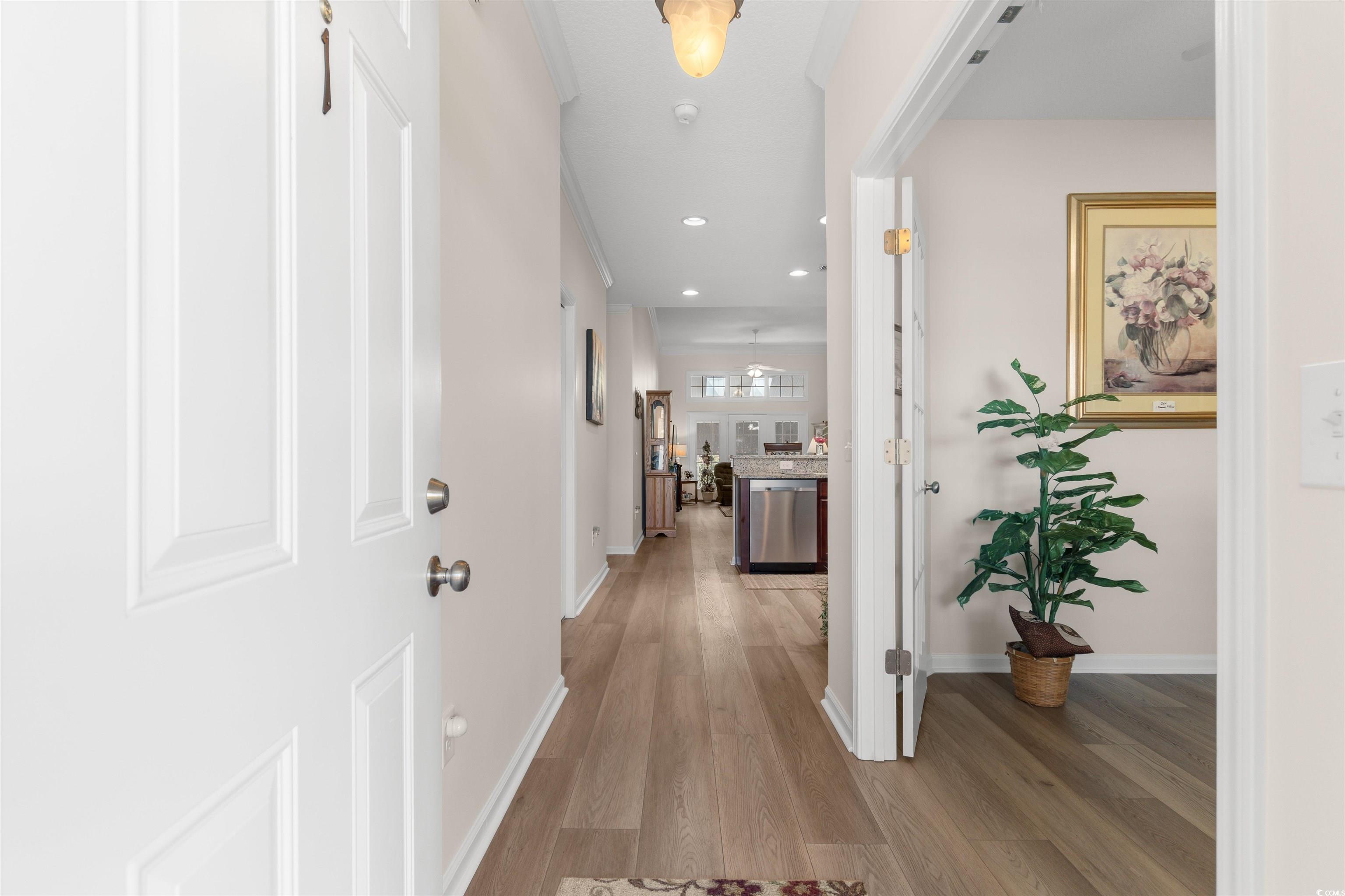 Hall featuring recessed lighting, light wood-type