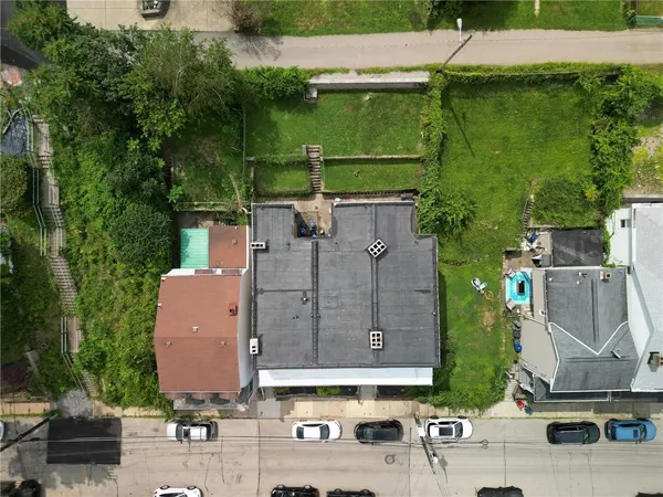 an aerial view of a house with a garden