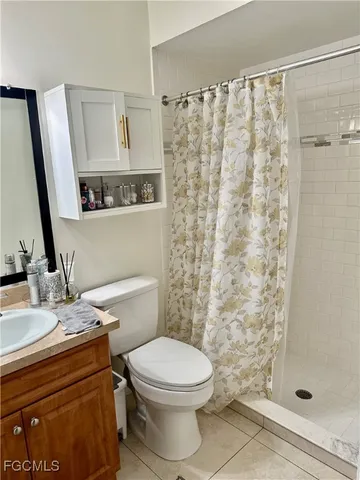 a bathroom with a toilet a sink and a shower