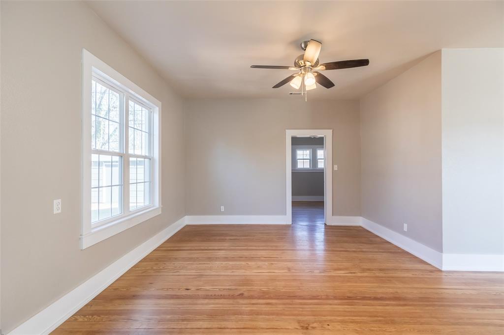 601 North Ave G Haskell, TX 79521 - Photo 14 of 36 a view of empty room with wooden floor and fan