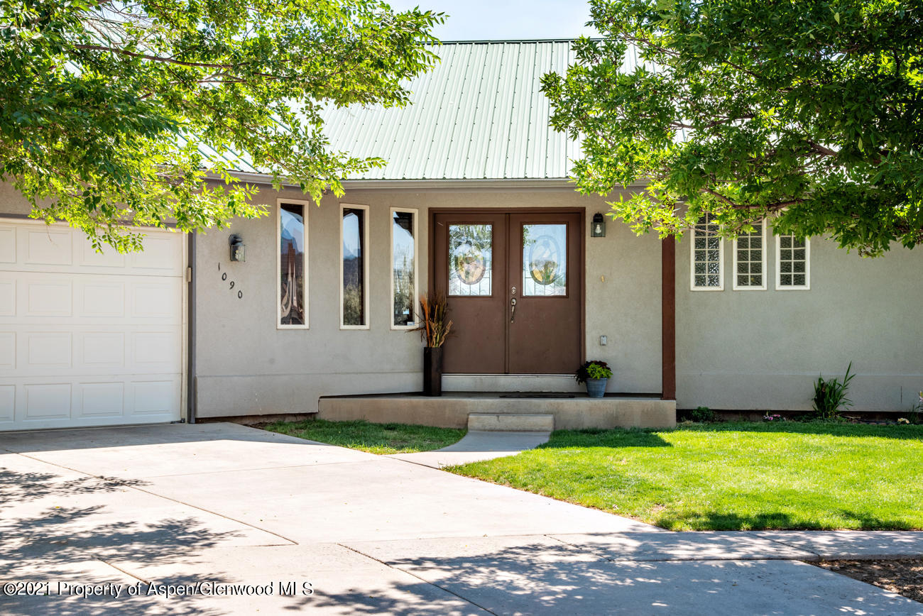 1090 Hickory Drive Rifle, CO 81650 - Photo 1 of 27 a front view of a house with garden