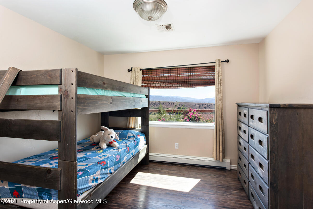 1090 Hickory Drive Rifle, CO 81650 - Photo 12 of 27 a bedroom with furniture and a window