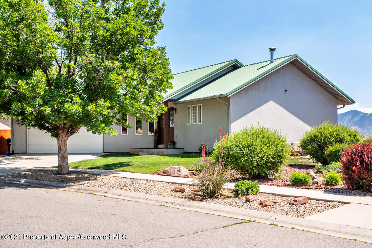 1090 Hickory Drive Rifle, CO 81650 - Photo 2 of 27 a house that has a tree in front of it