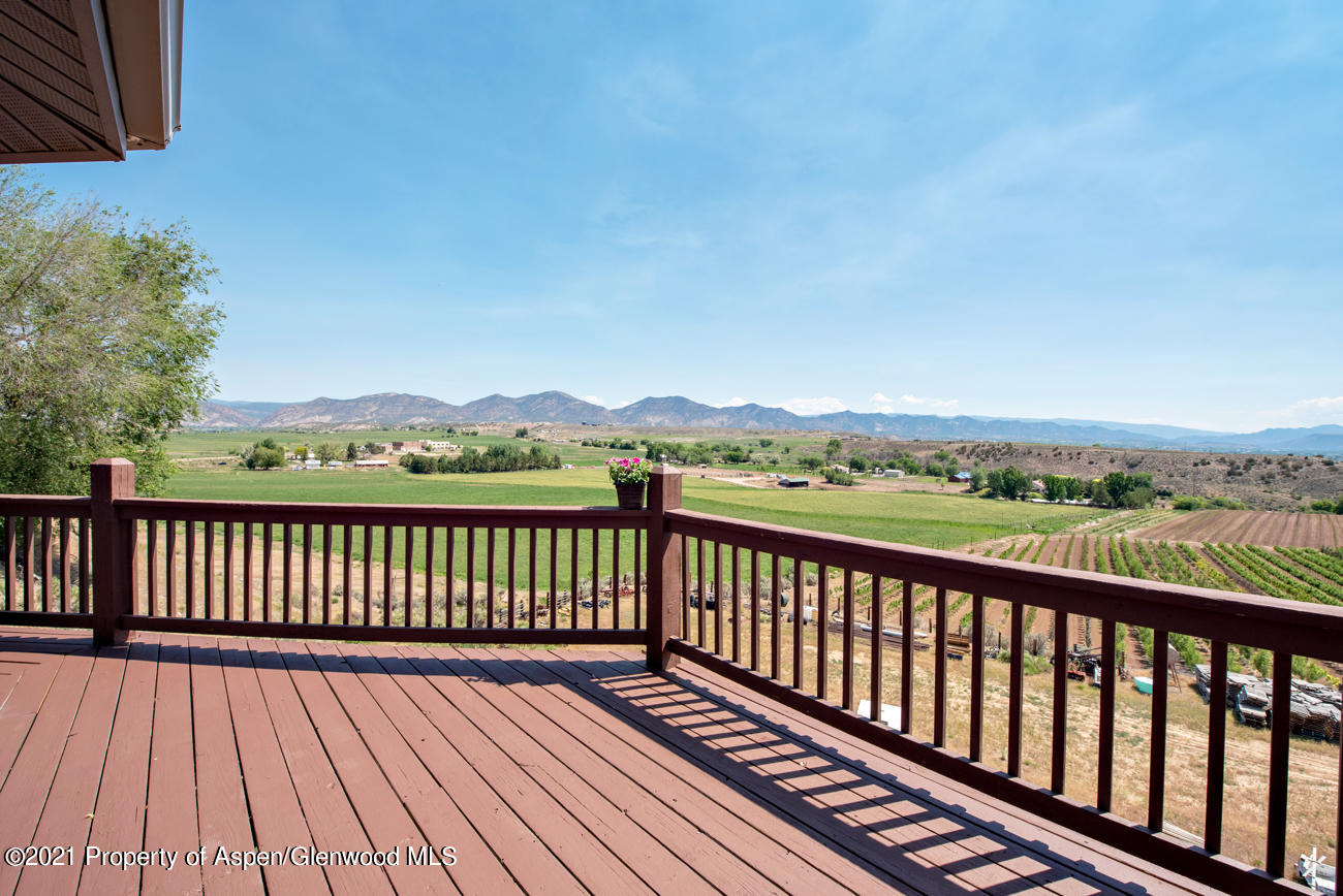 1090 Hickory Drive Rifle, CO 81650 - Photo 24 of 27 a view of balcony with wooden floor and fence