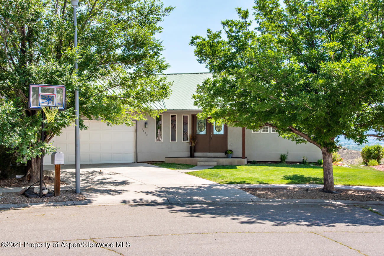 1090 Hickory Drive Rifle, CO 81650 - Photo 26 of 27 a house that has a tree in front of it