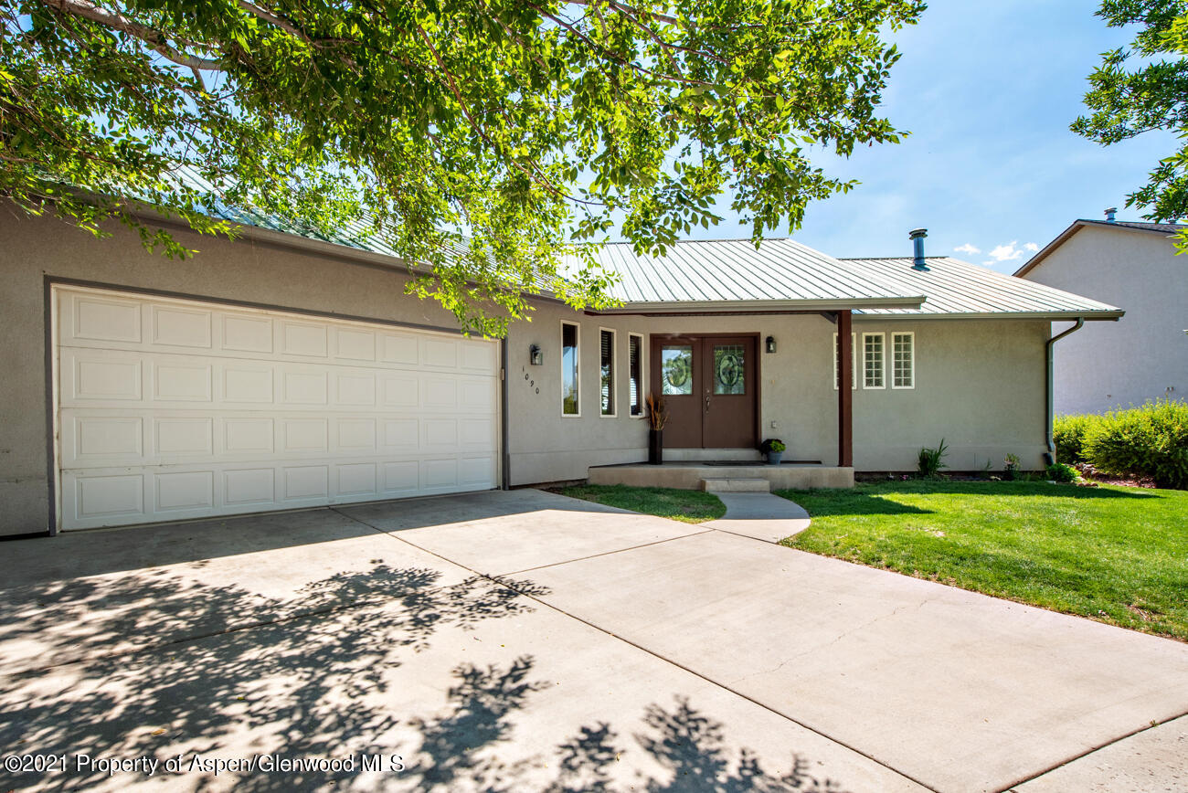 1090 Hickory Drive Rifle, CO 81650 - Photo 27 of 27 a front view of a house with a garden