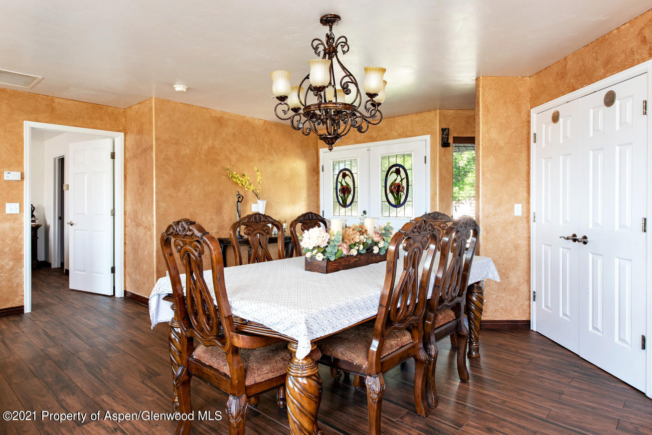 1090 Hickory Drive Rifle, CO 81650 - Photo 3 of 27 a view of a dining room with furniture and wooden floor