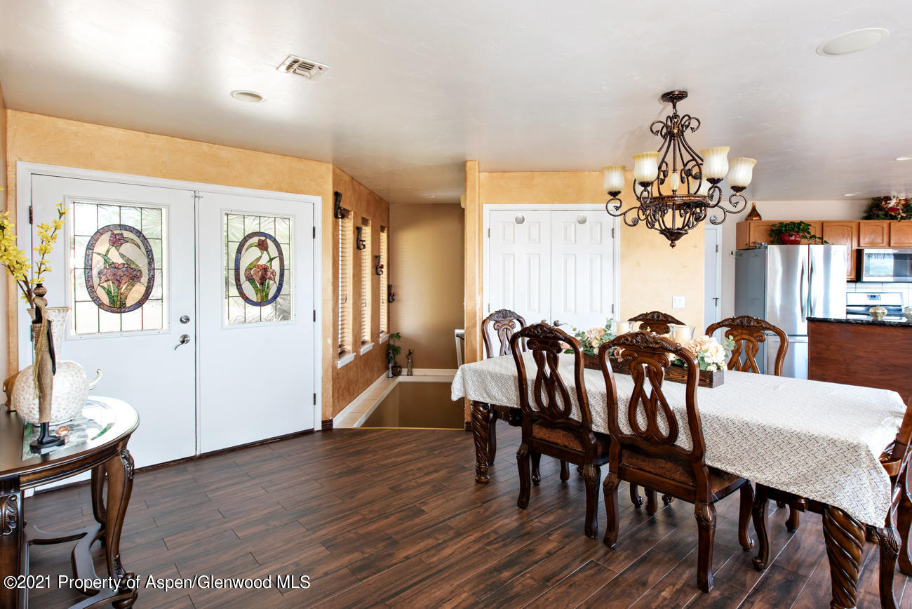 1090 Hickory Drive Rifle, CO 81650 - Photo 5 of 27 a view of a dining room with furniture and a chandelier