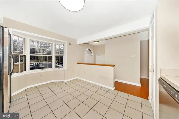 a kitchen with a sink a stove cabinets and counter space