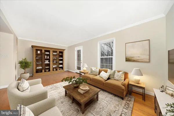 an empty room with wooden floor and door