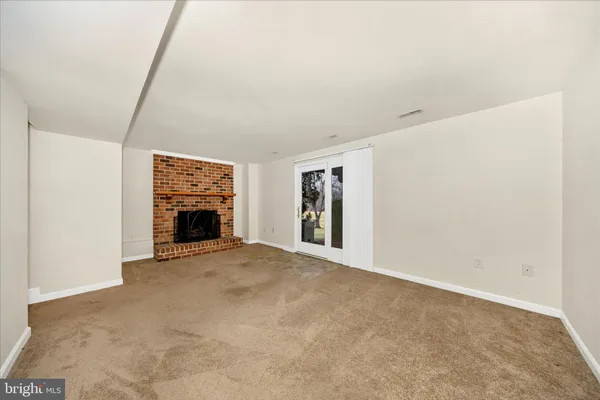 a view of a apartment with a large tree