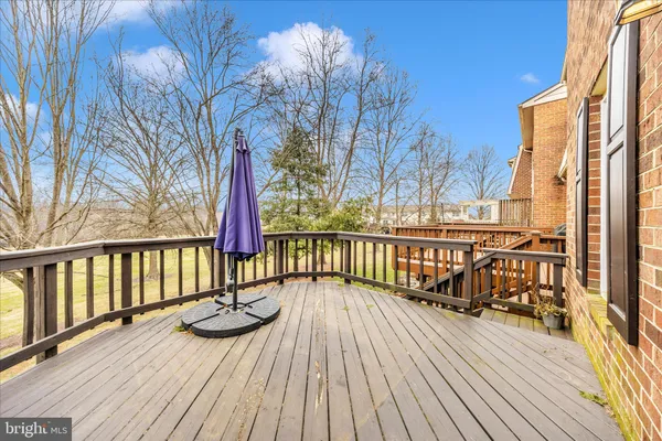 a view of balcony with wooden floor and seating space