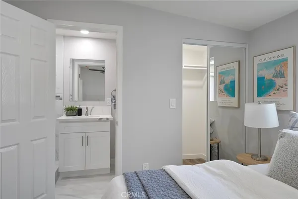 a bedroom with a bed and a table