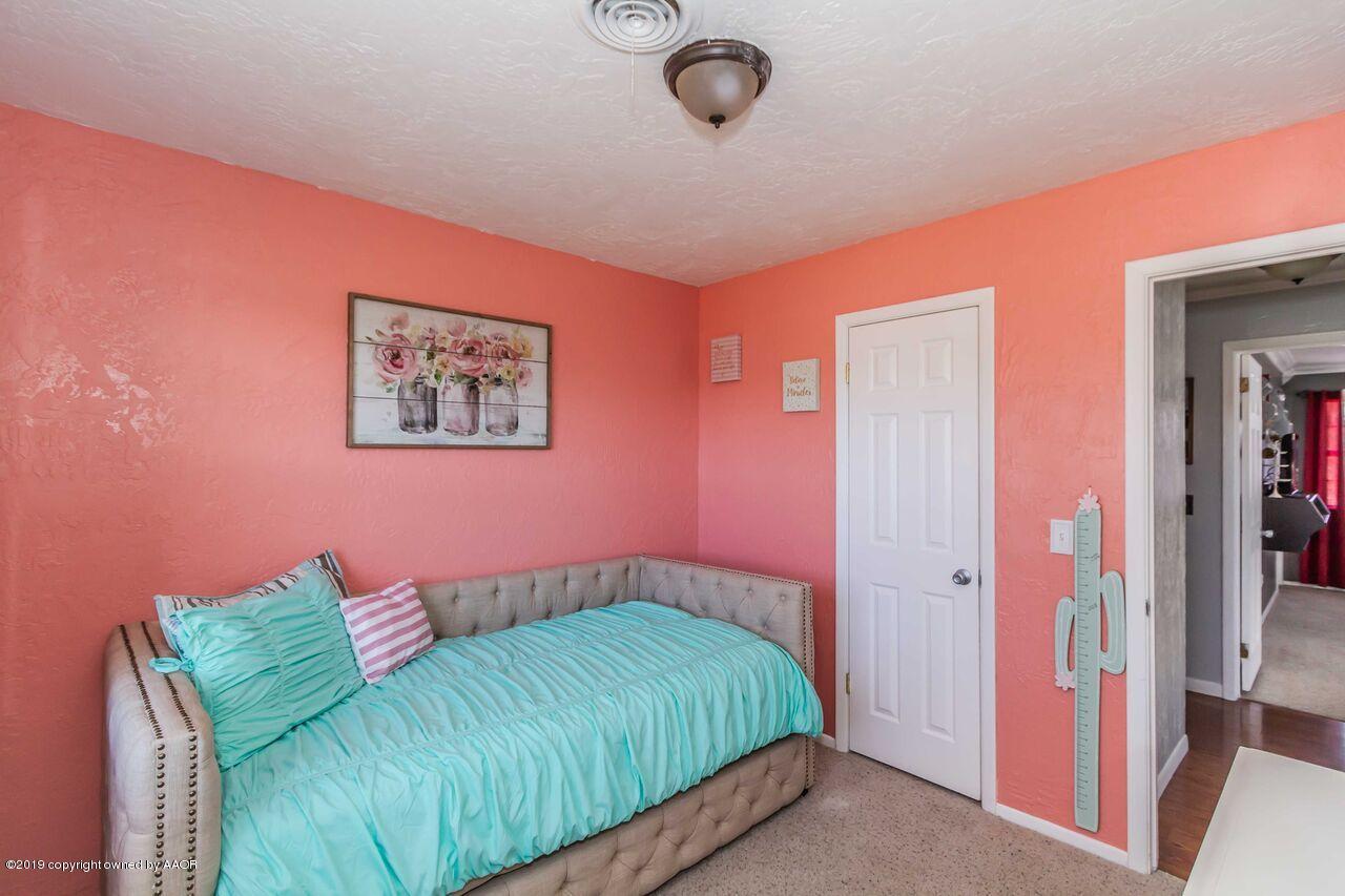 4709 Journey Street Amarillo, TX 79110 - Photo 34 of 43 a bedroom with a bed and a closet