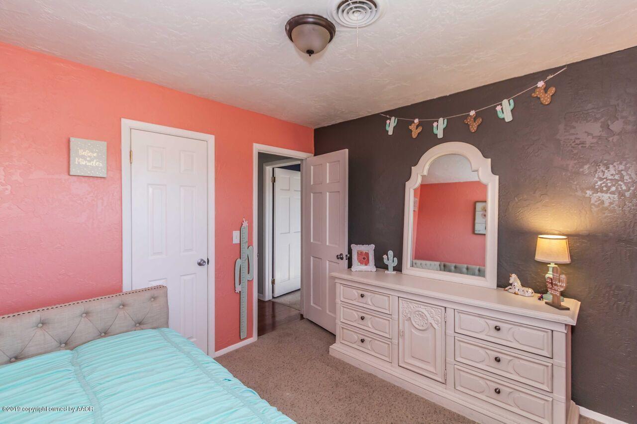 4709 Journey Street Amarillo, TX 79110 - Photo 35 of 43 a spacious bathroom with a double vanity sink and a mirror