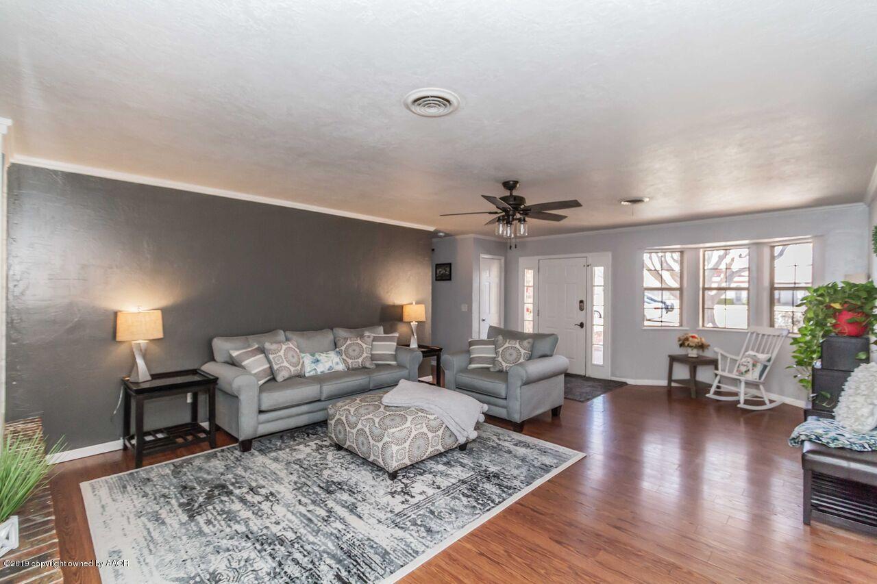 4709 Journey Street Amarillo, TX 79110 - Photo 7 of 43 a living room with furniture and wooden floor