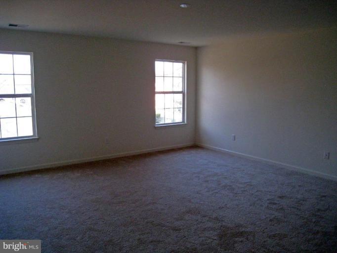 8012 Clark Station Road Severn, MD 21144 - Photo 7 of 8 an empty room with a window