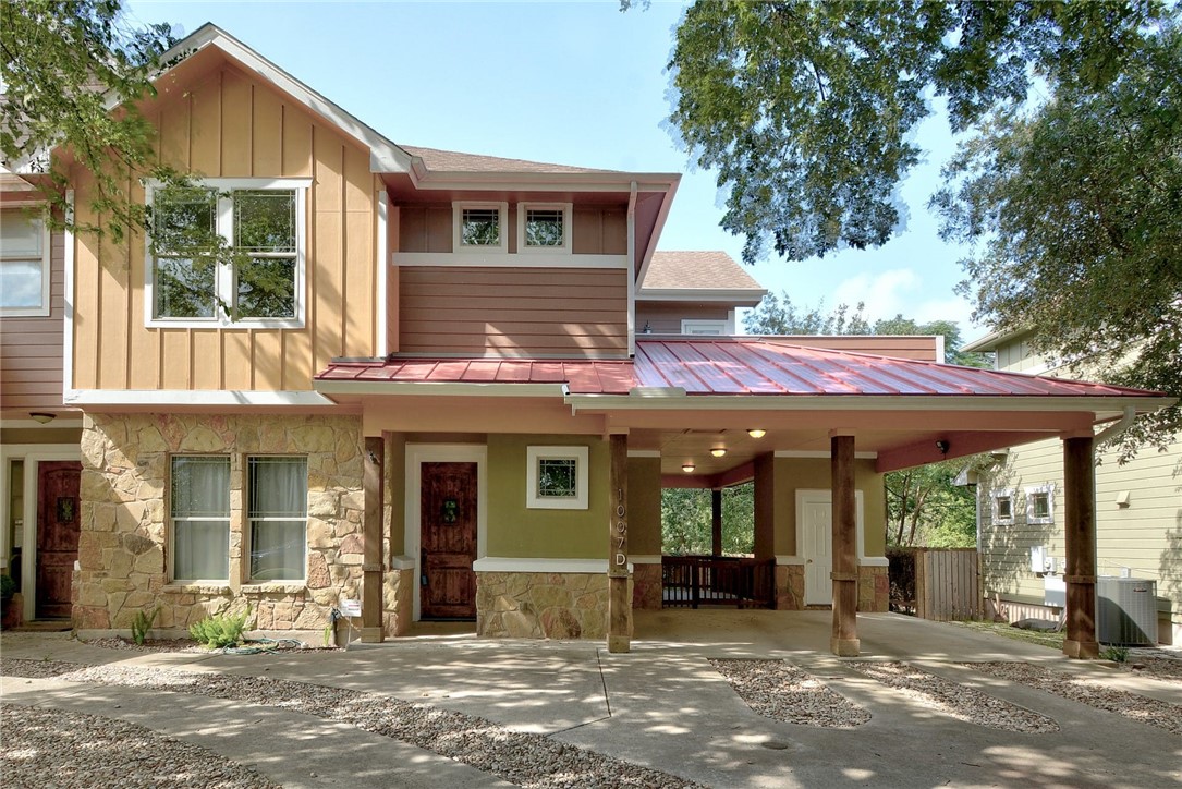 1007 Taulbee Lane, Unit D Austin, TX 78757 - Photo 1 of 1 a view of a house with a porch and a large window