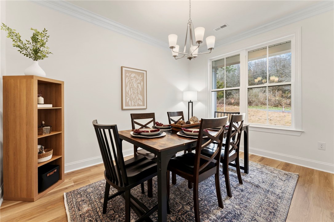 505 Fire Tower Road Williamston, SC 29697 - Photo 11 of 37 This dining area showcases a warm, inviting space with natural light.